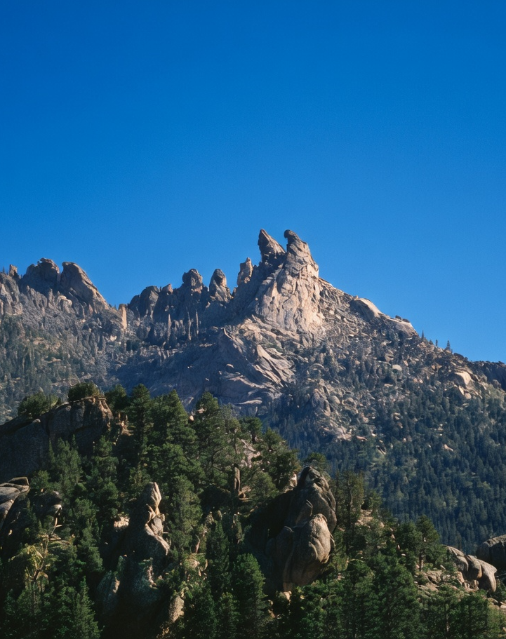 Rugged mountain ridge under a deep blue sky — emblematic of the remote terrain Twin Eagle Solutions serves
