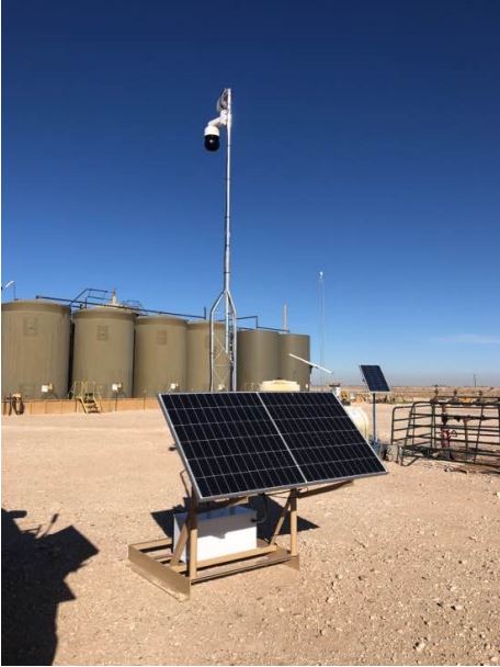 Solar-powered camera and radio skid serviced by Twin Eagle aerial-lift crew